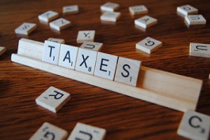 Scrabble Tiles that say Taxes