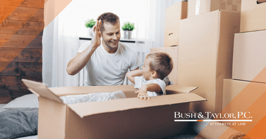 Father and son packing boxes.