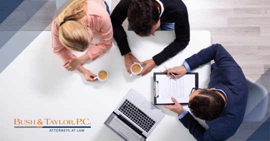 Couple sitting with lawyer.