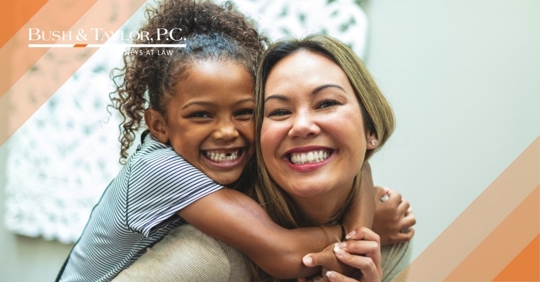 Woman holding daughter.