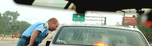 Police Officer next to car